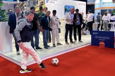 Visitor taking part in the Platform Parts Cup football challenge at the Platform Parts stand during APEX 2026.