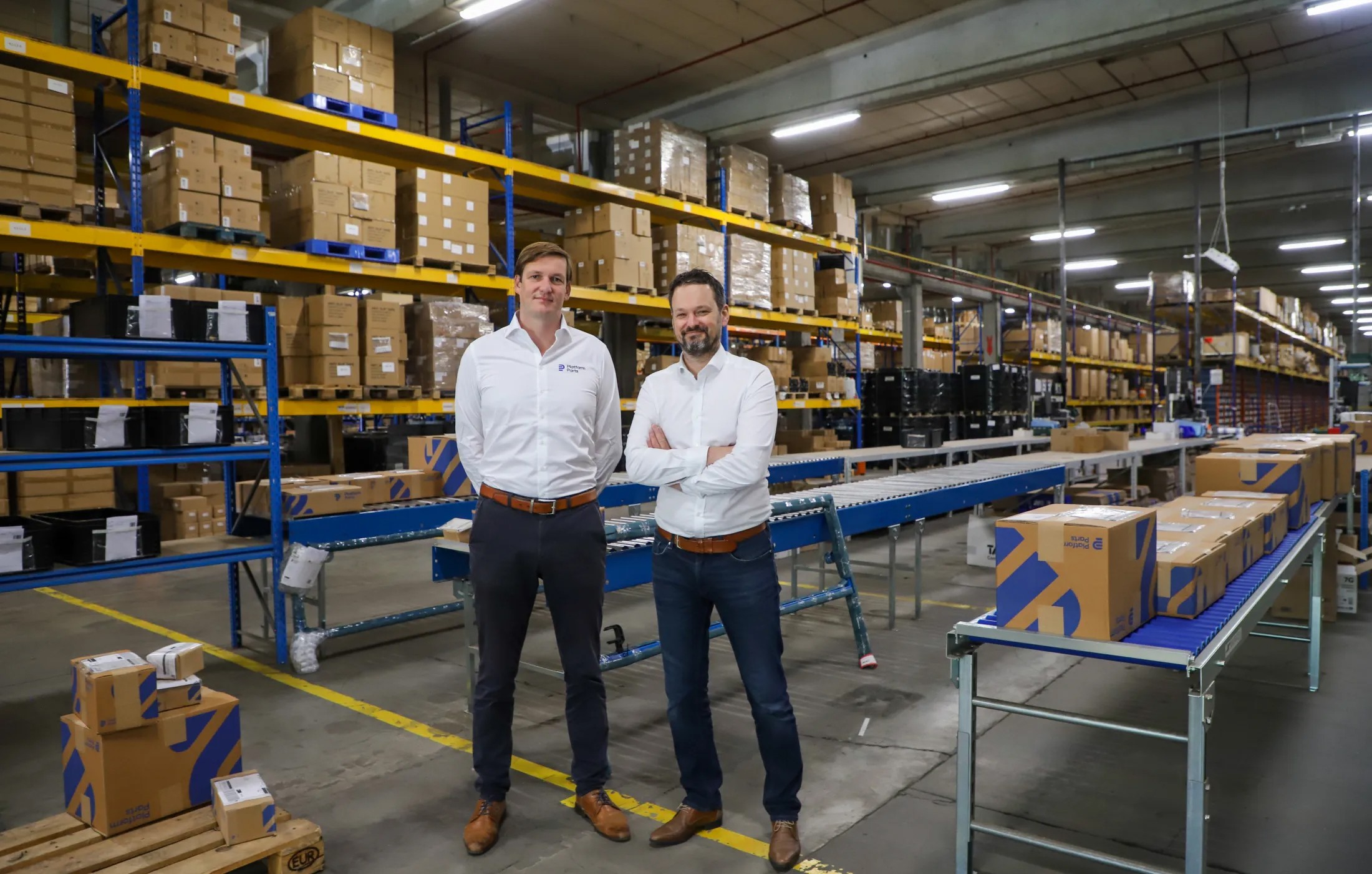 Mathieu Naessens and Karel Ghistelinck in the Platform Parts warehouse.
