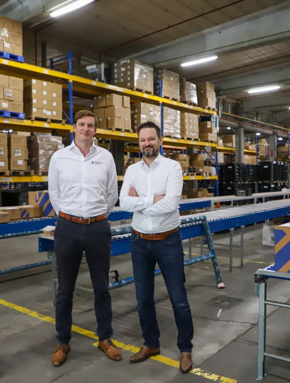 Mathieu Naessens and Karel Ghistelinck in the Platform Parts warehouse.
